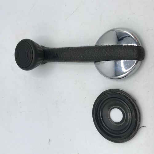 Window crank with underlayment, used condition